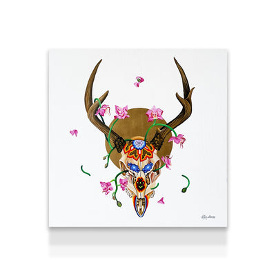 Decorative deer skull with floral and butterfly design on a white background